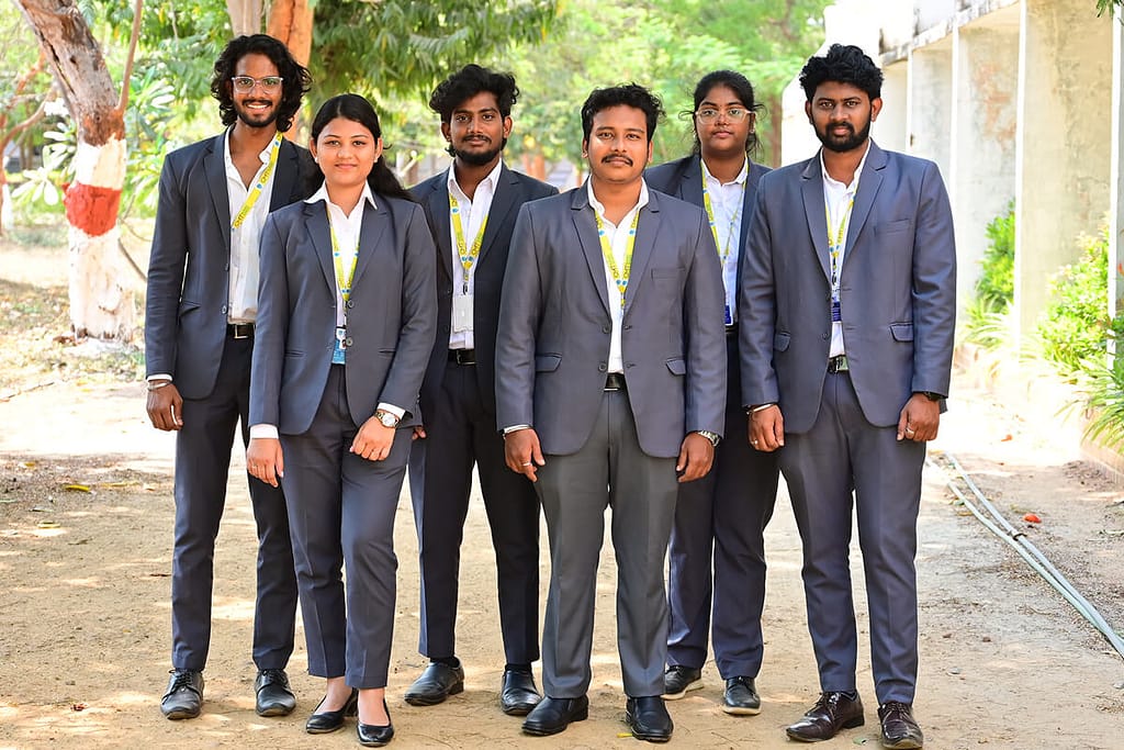 Students Standing Beside CMT Building