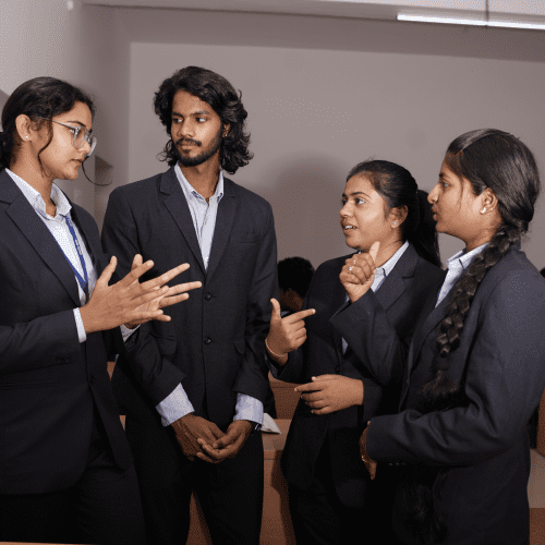 students having a group discussion with college uniform